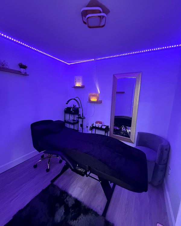 Private treatment room with violet lighting
